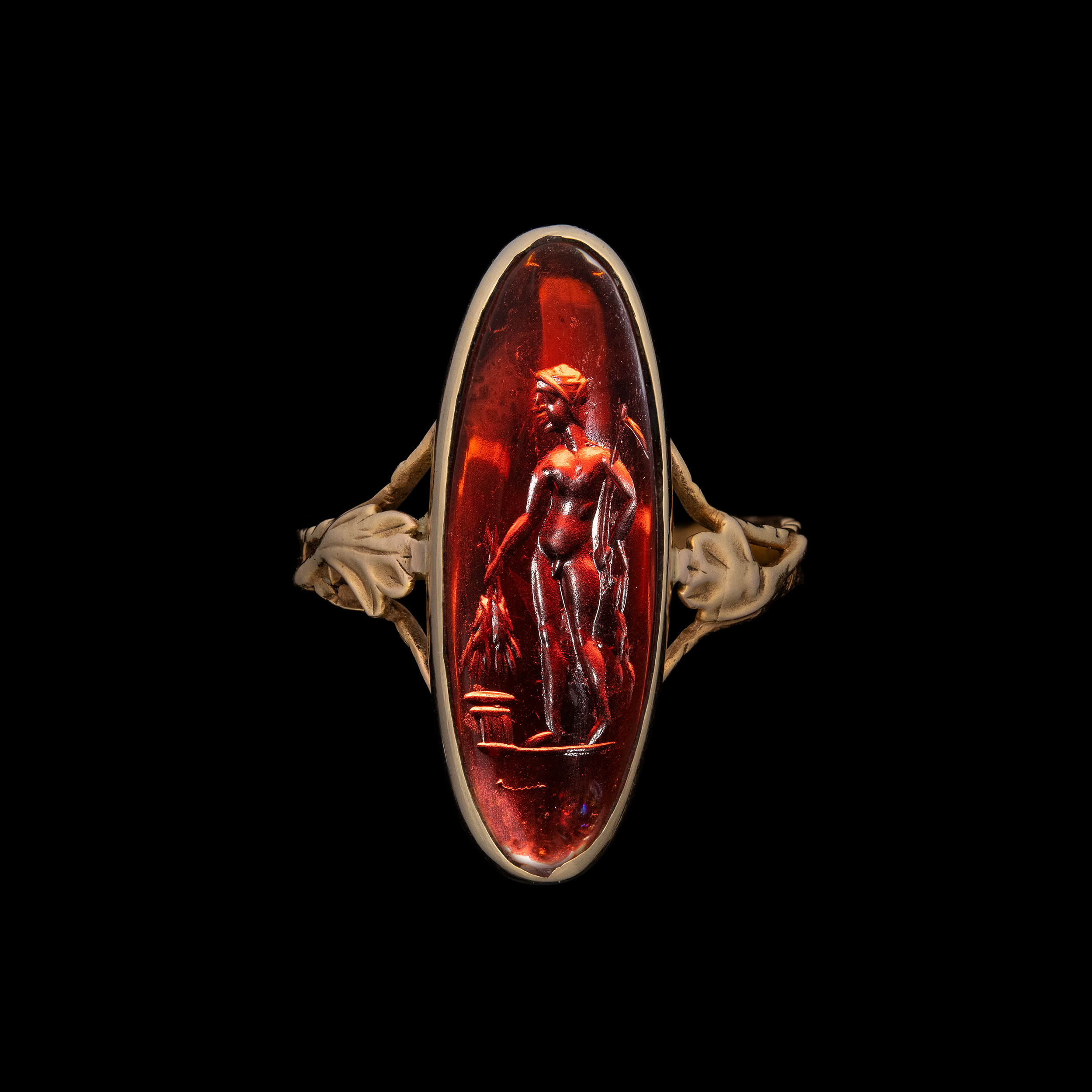A Late Georgian gold ring set with a Late Hellenistic garnet intaglio. Triptolemus.